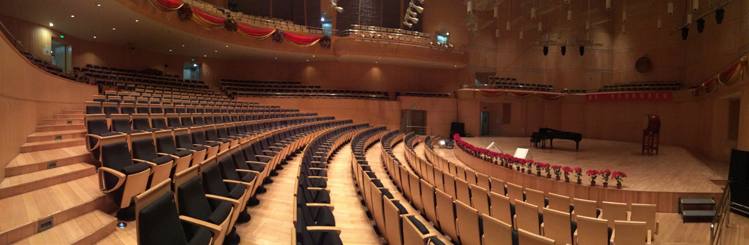 Concert hall stage set for a grand piano performance
